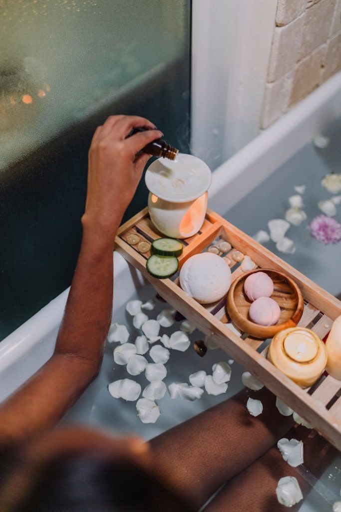 A soothing spa bath scene with oil, candles, and flower petals for ultimate relaxation.